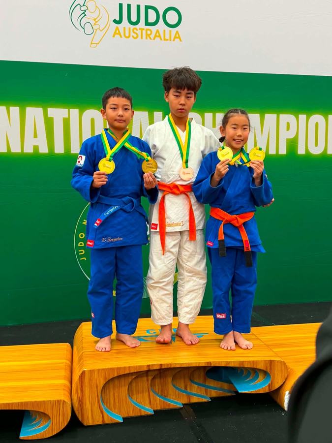Respect Judo Club students on the podium with medals